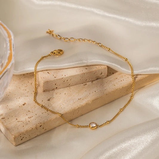 Tobillera Uworld Dainty de acero inoxidable chapado en oro de 18k, resistente al agua, con cadena de regalo y un solo circonita. Joyería y accesorios.